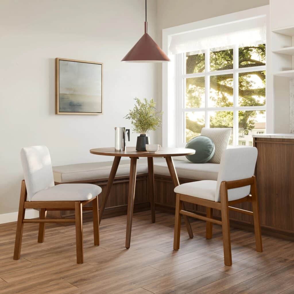 Two white upholstered budget-friendly dining chairs and a small wooden table.