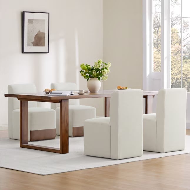Linen faric dining chairs from Lowe's around a rectangular wood table from our budget-friendly dining chairs guide.