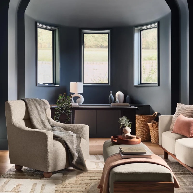 Living room with soft bouclé sofa and chair and bench with mohair throws.