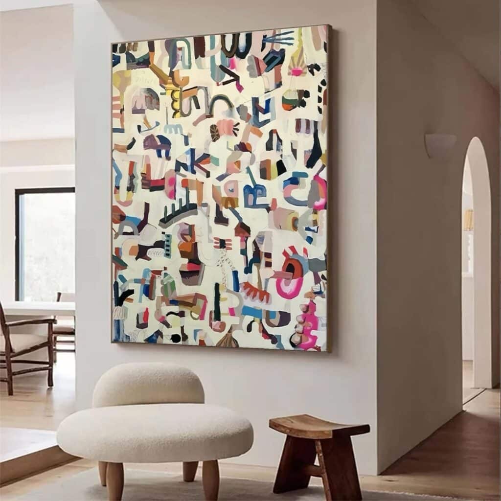 Large, multi-colored abstract art print in an entryway from our home decor gift guide.