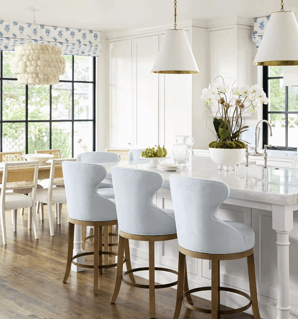 Serena & Lily white barstools at a white kitchen island from our interior designer NYC reviews guide.