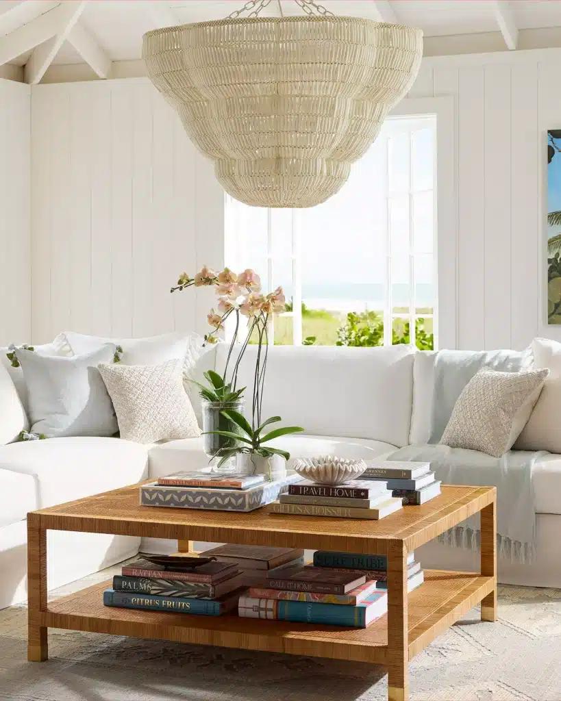 Living room sofa styled with multiple throw pillows and a draped blanket for a finished look.