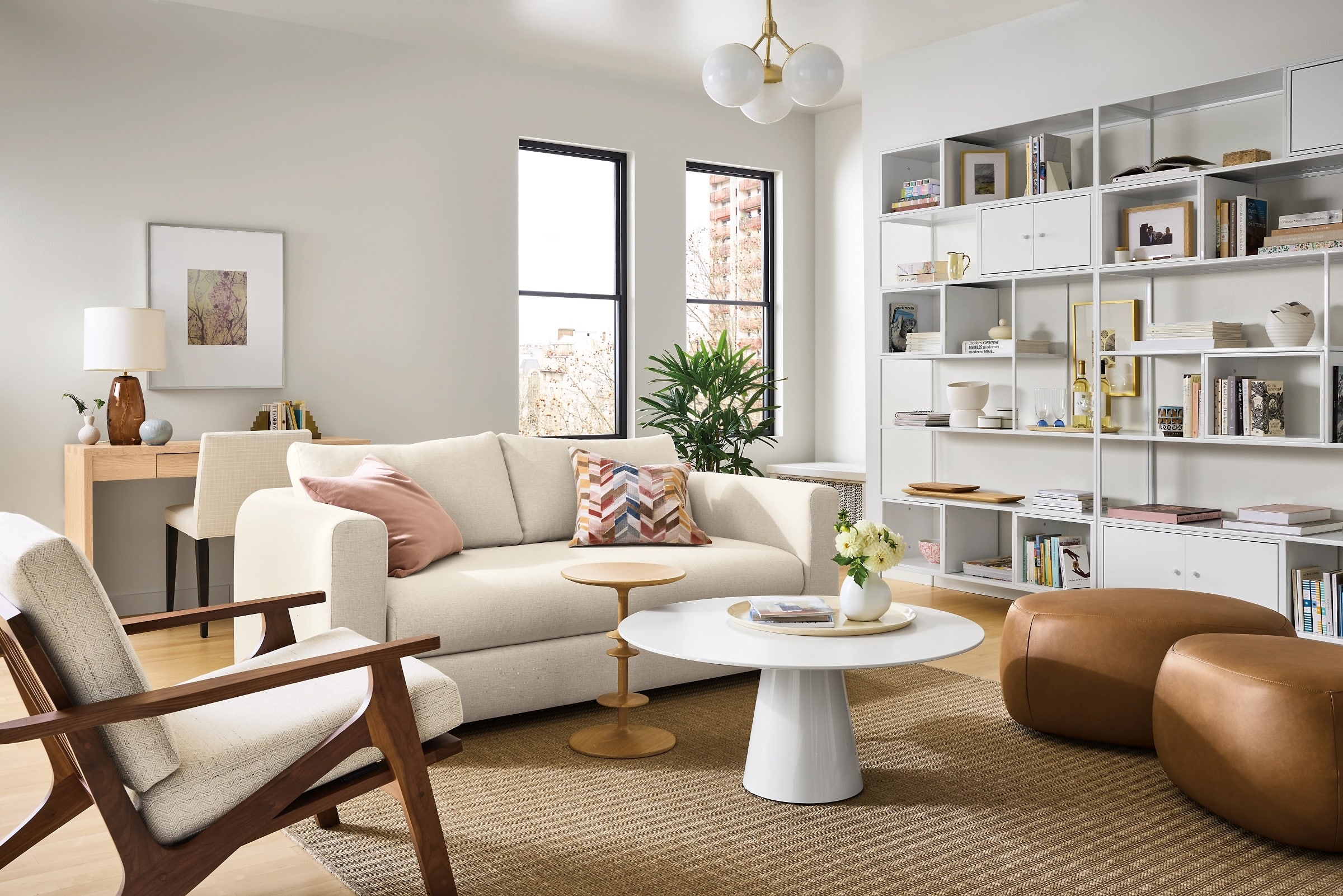 White round coffee table centered in a living room seating area with balanced proportions.