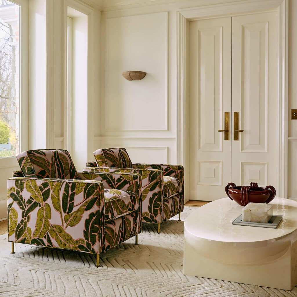 Bold accent chairs used as a focal point in a balanced modern living room layout.