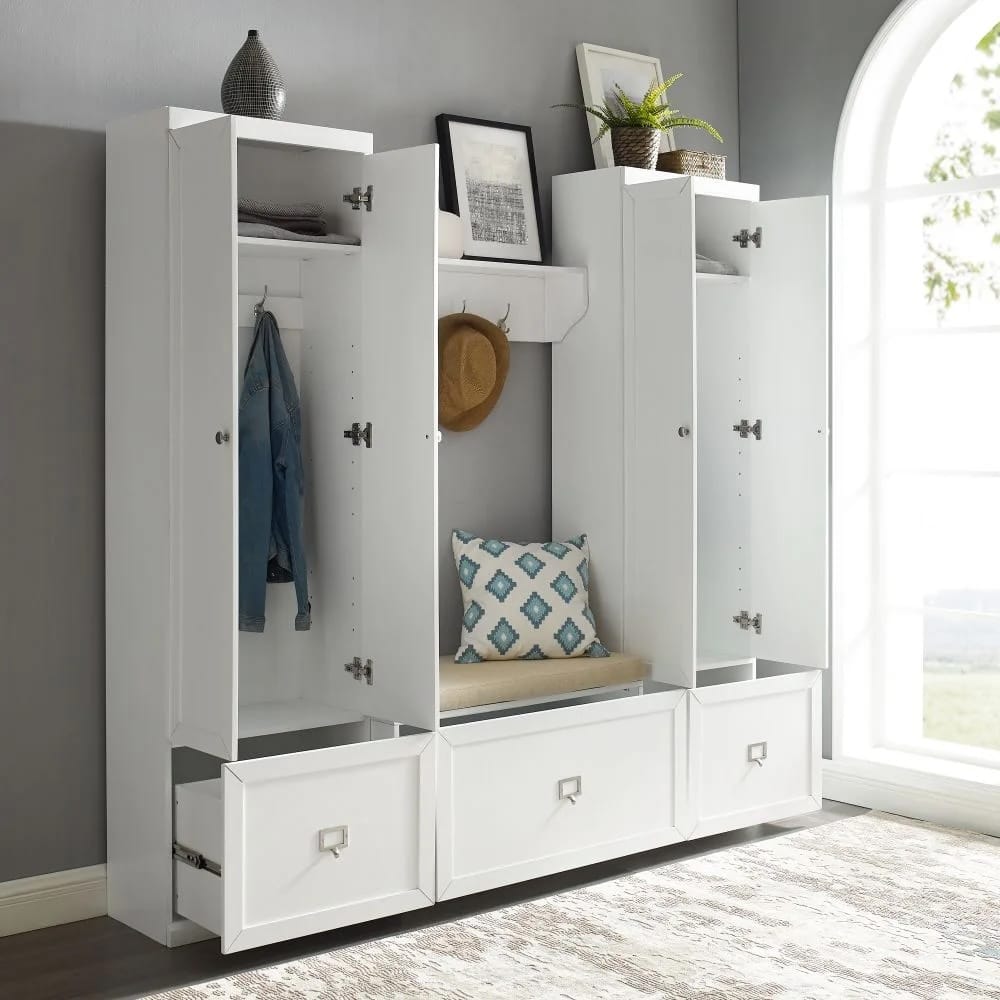 Entryway with closed storage furniture hiding coats and accessories for a streamlined look.