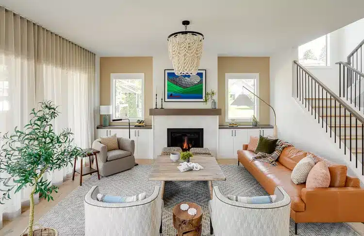 Living room seating with accessible side tables near every chair and sofa.
