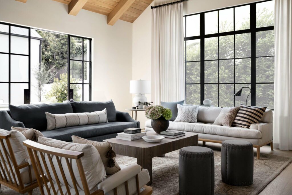 Living room with structured chairs providing proper seating instead of only ottomans.