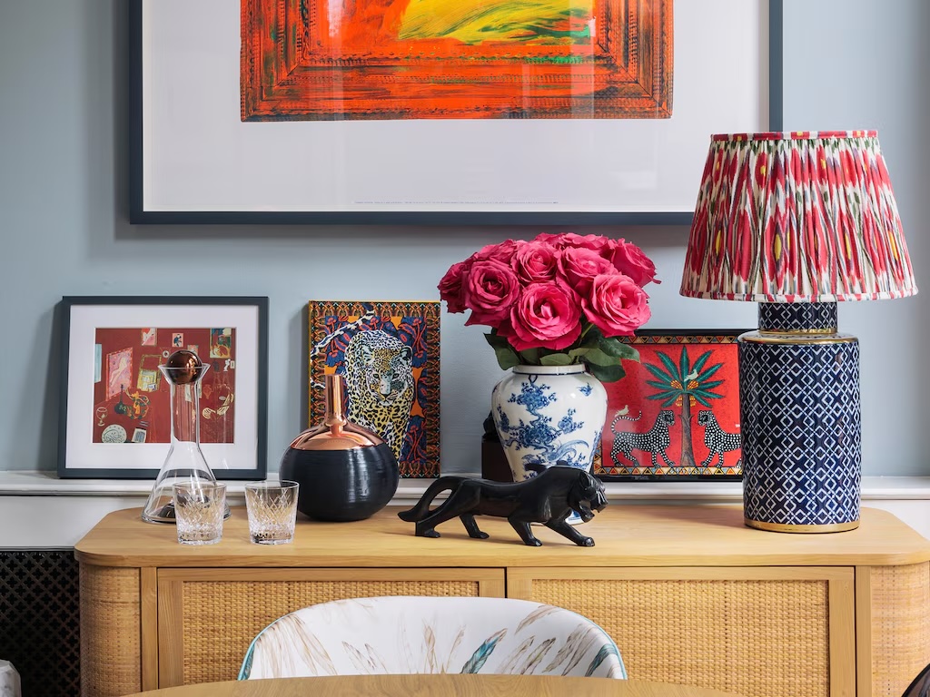 Console with lamp topped in ikat fabric.