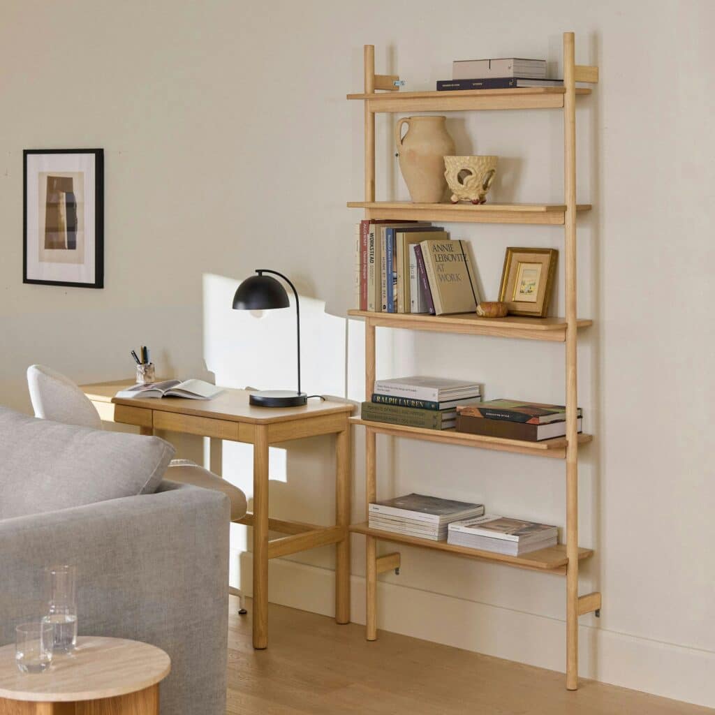 Living room featuring tall shelving to add vertical balance and dimension.