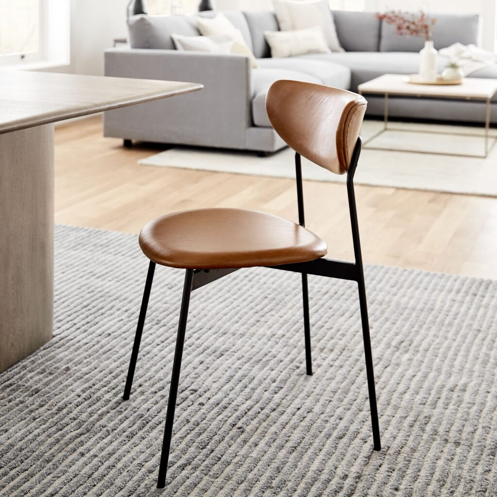 Dining room featuring select mid-century modern furniture mixed with contemporary pieces.