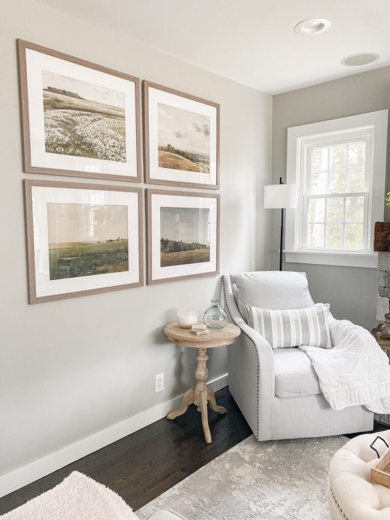 Large framed artwork leaning against a wall in an empty corner.