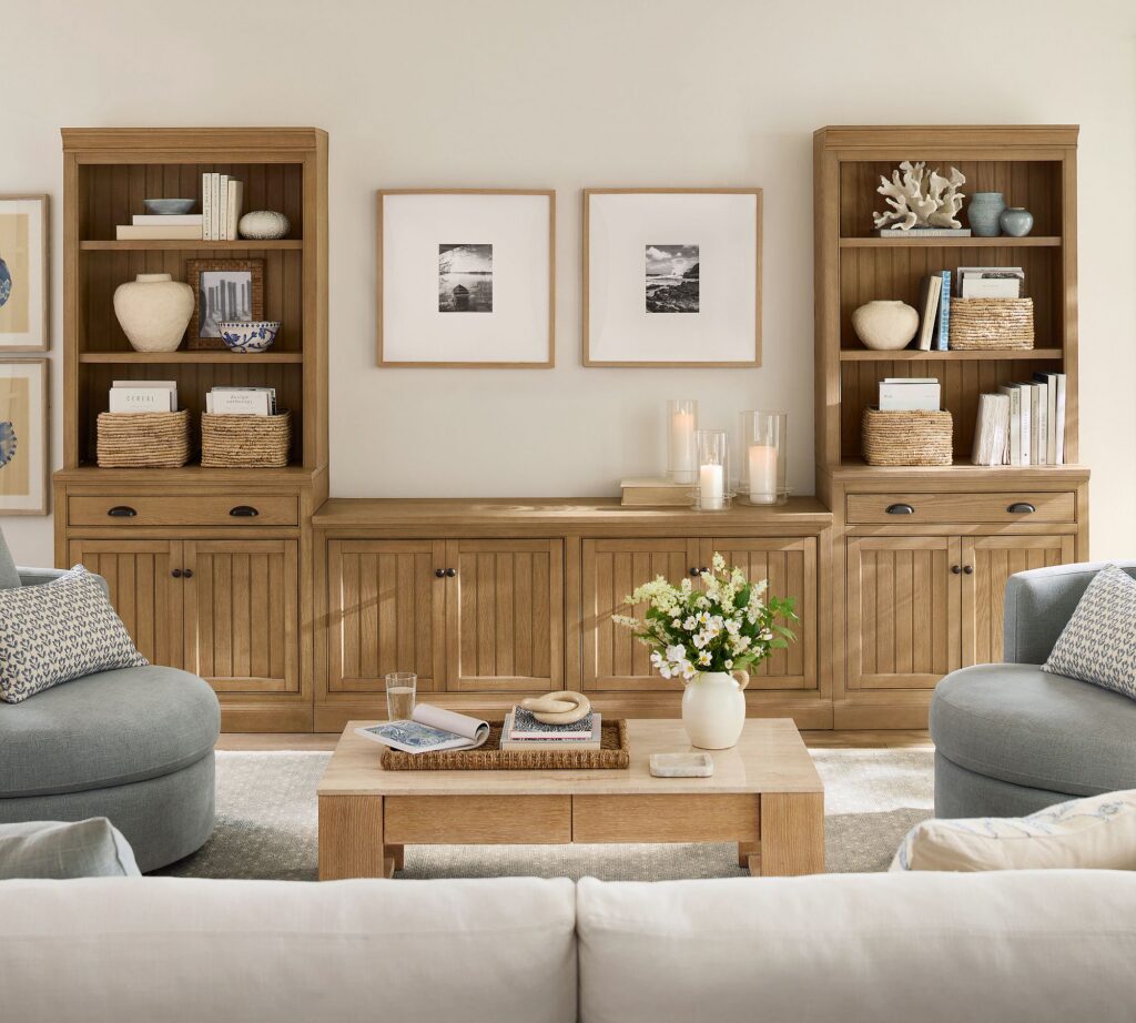 Living room with a throw pilliws, vases, and decor.