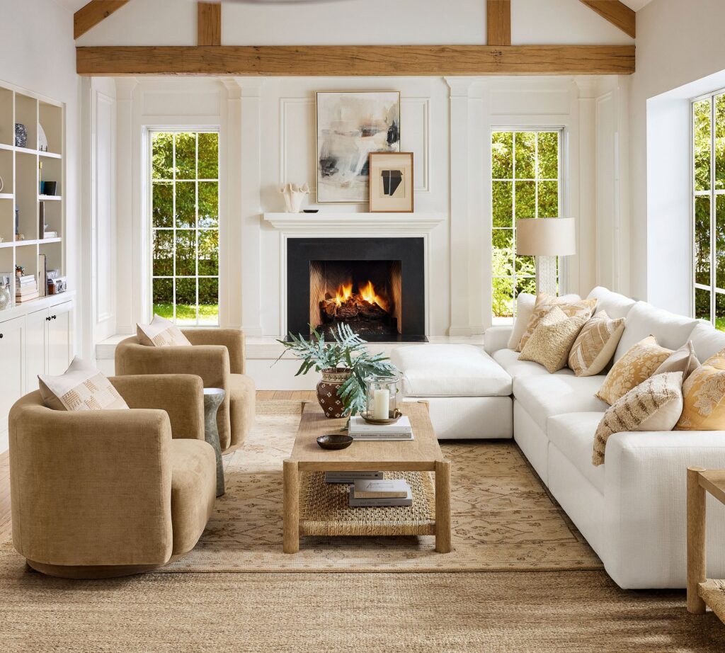 Neutral patterned area rug anchoring a living room seating area.