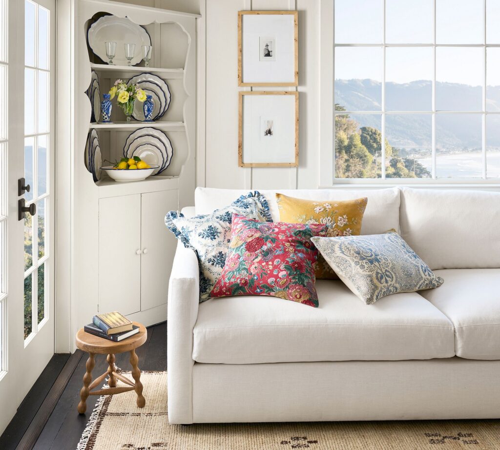Textured throw pillows styled on a neutral sofa.