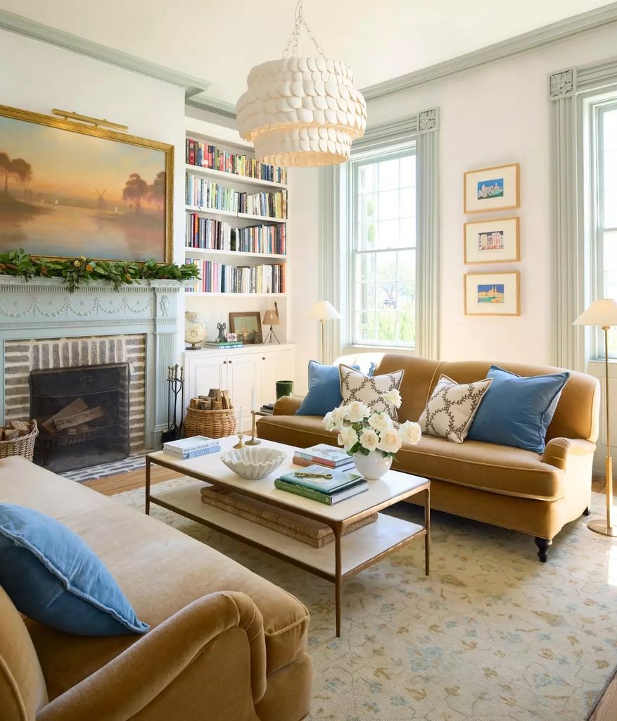 Coordinating table lamps and a different overhead light used together in a living room.